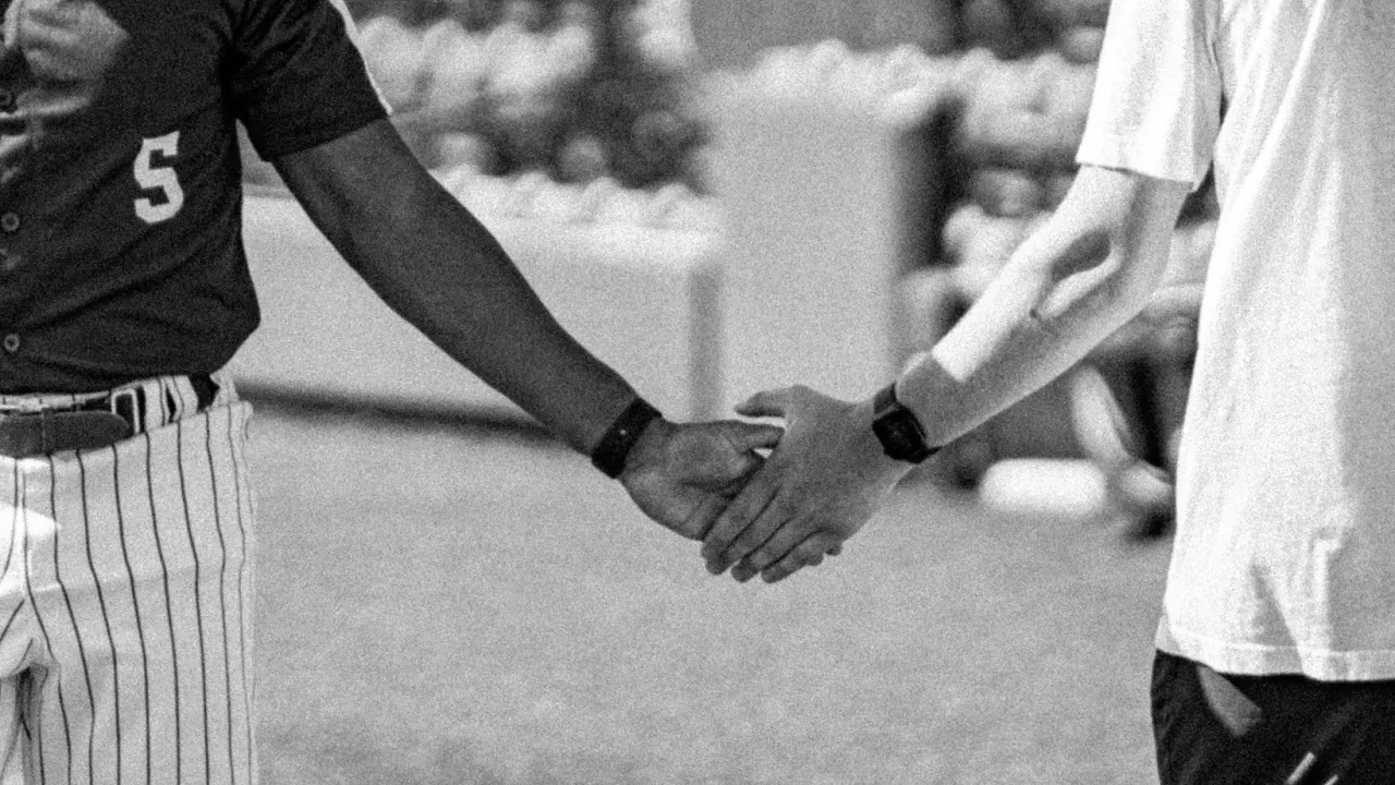 baseball players holding hands
