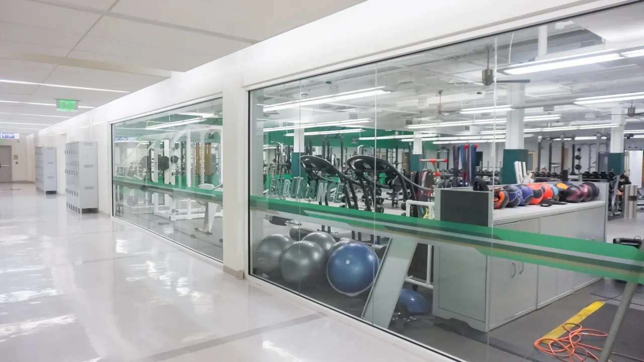 hallway view through to Belk weight room