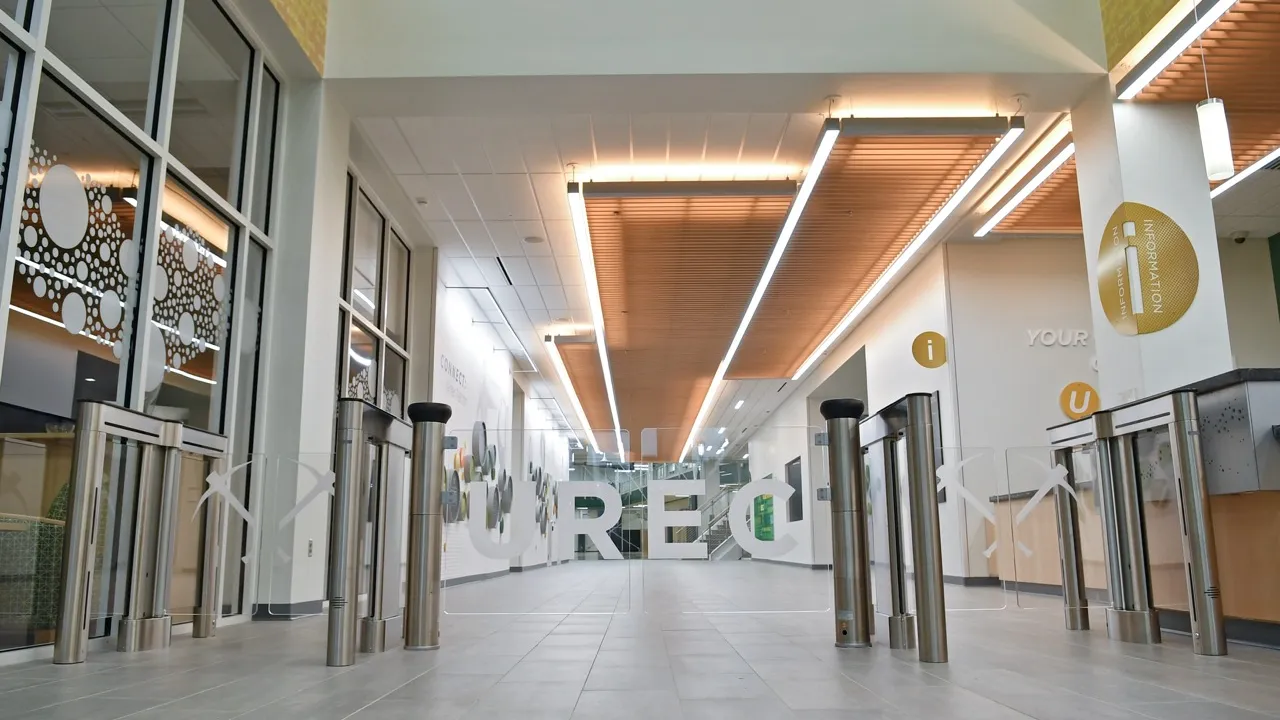 entrance gates of University Recreation Center reading "UREC" across the gates